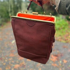 Elegant Brown Handbag with Orange Interior